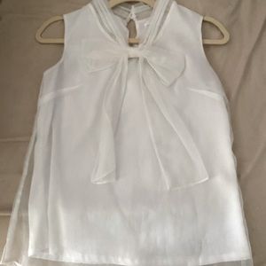 NWOT Chicwish Size XS sheer, lined top with bow detail.
